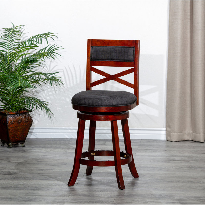 Tabouret de bar pivotant de 61 cm (24 po) avec structure stable, finition cerisier, assise en tissu anthracite. Rotation à 360 degrés. Pieds évasés en mousse confortable pour une stabilité accrue.