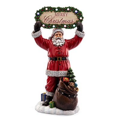 Santa Holding Merry Christmas Sign