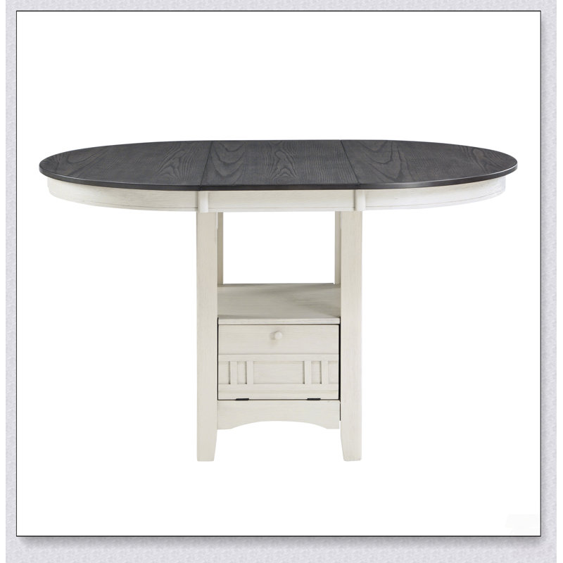 Table de salle à manger haute traditionnelle avec rallonge et base de rangement pour des réunions de famille élégantes.