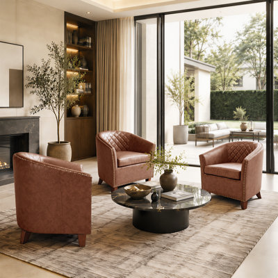 Fauteuil demi-tonneau en cuir moderne avec dossier capitonné à losanges et garniture cloutée