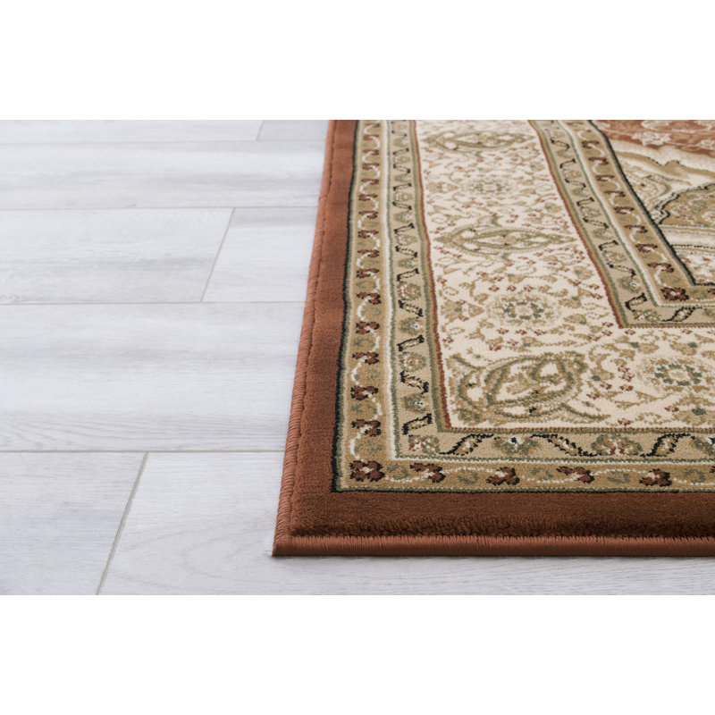Harpersville Oriental Area Rug in Brown/Ivory