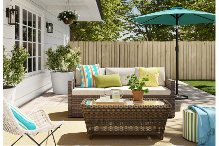 outdoor patio with a wicker patio sofa