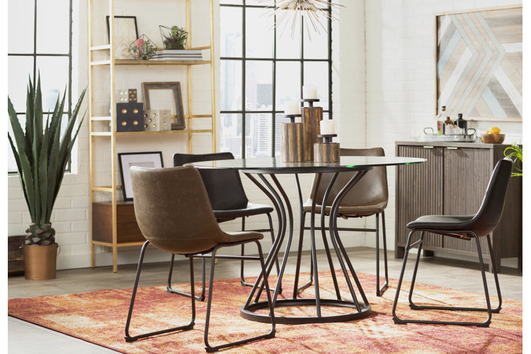 small industrial-style dining room with a four-person table