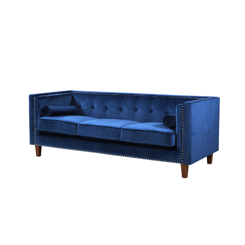 Canapé Chesterfield 3 places capitonné avec coussins cylindriques