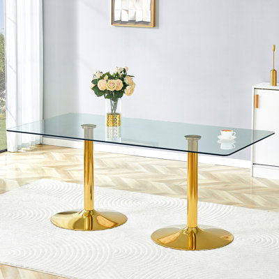 Un plateau de table en verre avec une table de salle à manger circulaire minimaliste moderne avec des pieds en métal galvanisé. Convient aux restaurants et aux salons.