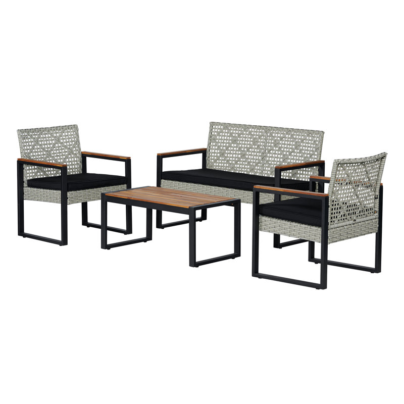 Ensemble de conversation d'extérieur en rotin PE tissé blanc 4 pièces avec table en bois d'acacia, structure en métal noir et coussins noirs Wilder