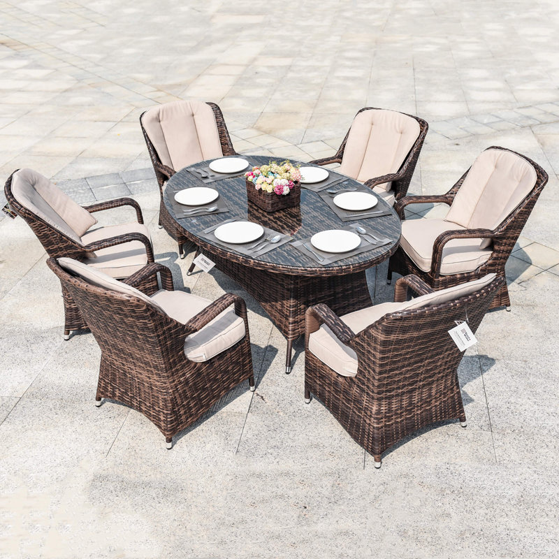 Ensemble repas d'extérieur 7 pièces avec table ovale en osier et coussins PE Ravenna, Beige/brun