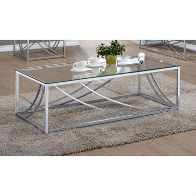 Table basse en verre et chrome avec pieds en métal