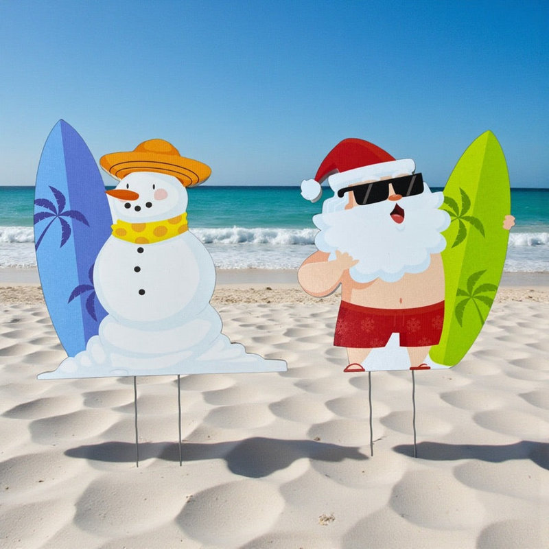 Panneaux de jardin sur le thème du surf côtier avec le père Noël et le bonhomme de neige