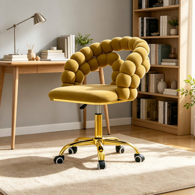 Fauteuil de coiffeuse pivotant en velours jaune avec base dorée