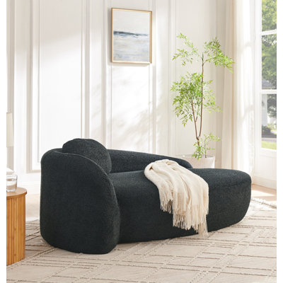 Fauteuil paresseux moderne simple ovale avec dossier intégré, accoudoirs latéraux et coussin, chaise longue compacte peu encombrante pour le salon - noir