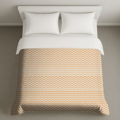 Housses de couette orange et blanches en zigzag