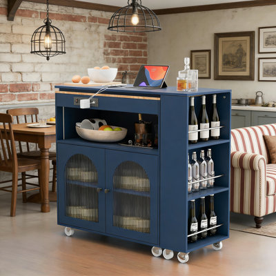 Rolling Kitchen Island with Extendable Table, LED Lighting, Power Outlets, and Fluted Glass Doors for Modern Kitchens.