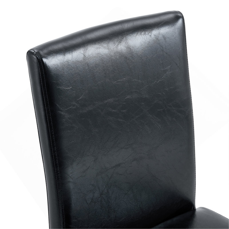 Ensemble de table et de chaises. Table de salle à manger élégante en verre trempé transparent - 71 po x 35,4 po avec 8 chaises de salle à manger en polyuréthane noir avec pieds en métal de couleur noyer. Mélange parfait de simplicité et de transparence.
