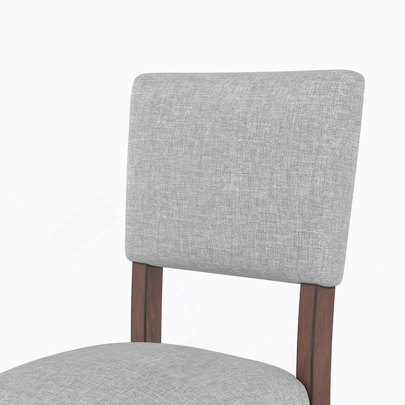 Ensemble de quatre tabourets de bar avec dossier Mid-Century modernes, revêtus de lin pour le confort, pieds en bois massif pour la durabilité, idéal pour les îlots de cuisine et les salles à manger.