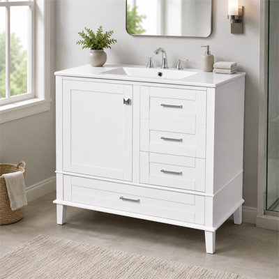 Meuble-lavabo moderne blanc de 87 cm de large avec lavabo intégré, structure en bois massif, 1 porte et 3 tiroirs à fermeture amortie pour le rangement de votre salle de bain.