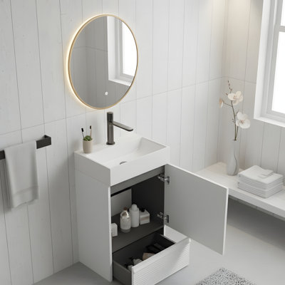 Modern standalone bathroom vanity with integrated white ceramic washbasin