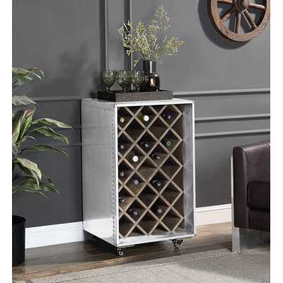 L'armoire à vin Raini en aluminium à conception mobile peut contenir 23 bouteilles et présente des matériaux mixtes durables pour un rangement moderne.