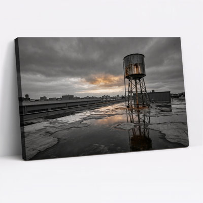 Rusty Water Tower on Wet Rooftop Canvas Wall Art