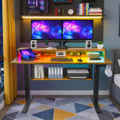 Electric standing desk, height adjustable, with storage space, standing gaming desk with LED light strip, suitable for home office and gaming, sit/stand workstation.