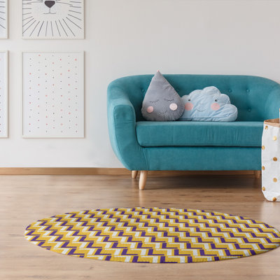 Tapis rond jaune / mauve à motif géométrique
