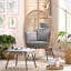 Chaise d'extérieur en osier avec repose-pieds