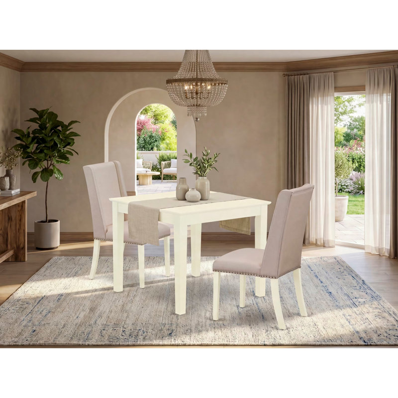 L'ensemble de table de cuisine 5 pièces pour 4 personnes comprend une table de salle à manger carrée et 4 chaises de salle à manger Parson en tissu crème, lin blanc