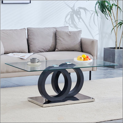Table basse de style moderne avec plateau en panneau de fibres à densité moyenne avec base noire, parfaite pour les salons contemporains et les espaces de détente, mesurant 47,2 po x 25,6 po x 17,8 po.