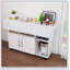 Table pliante multifonctionnelle avec tablettes et roulettes de rangement, idéale pour les petits espaces et polyvalente dans la cuisine, le dortoir ou le bureau