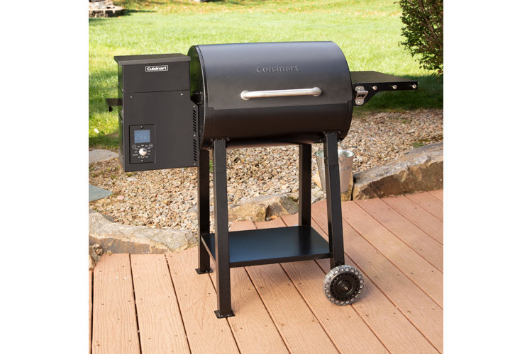 Black Cuisinart pellet grill on a deck.