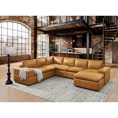 Canapé modulaire à large accoudoirs en cuir assorti