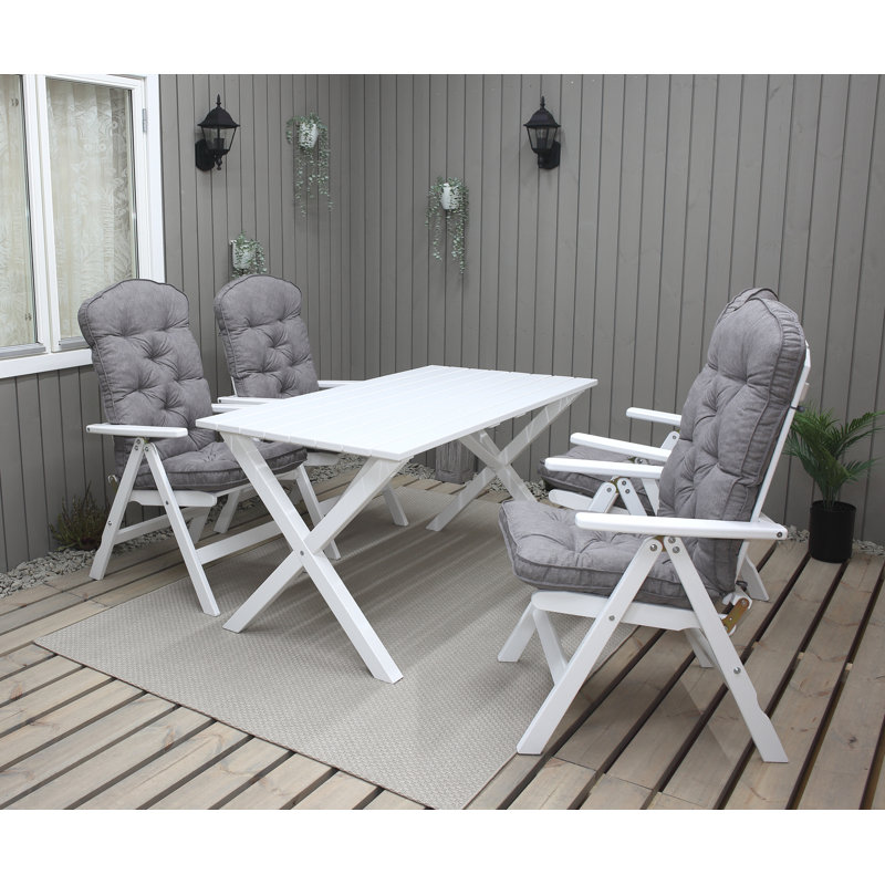 Capuano 4 - Person Wood Patio Dining Set with Rectangular Table , Cushions Included