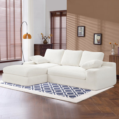 White Corduroy Compressed Sofa. It Has A Soft And Skin-Friendly Sitting Feel, Adding A Healing Atmosphere To The Warm Living Room. It Comes With 3 Back Cushions And 2 Throw Pillows.