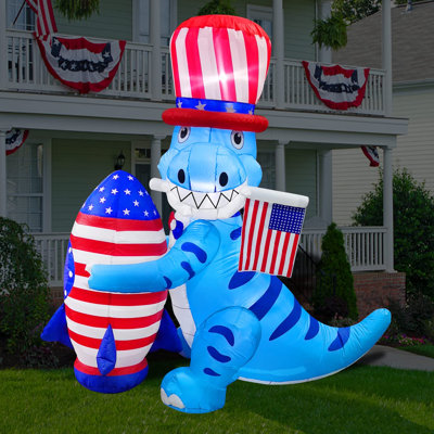 Dinosaure avec fusée et drapeau américain gonflable