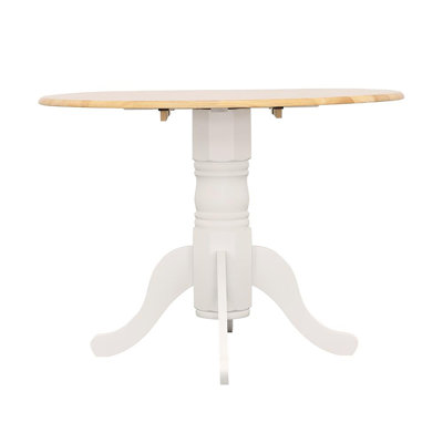 Versatile Drop Leaf Table With Stylish Pedestal Base And Ornamental Legs For Intimate Dining And Space Adaptability.
