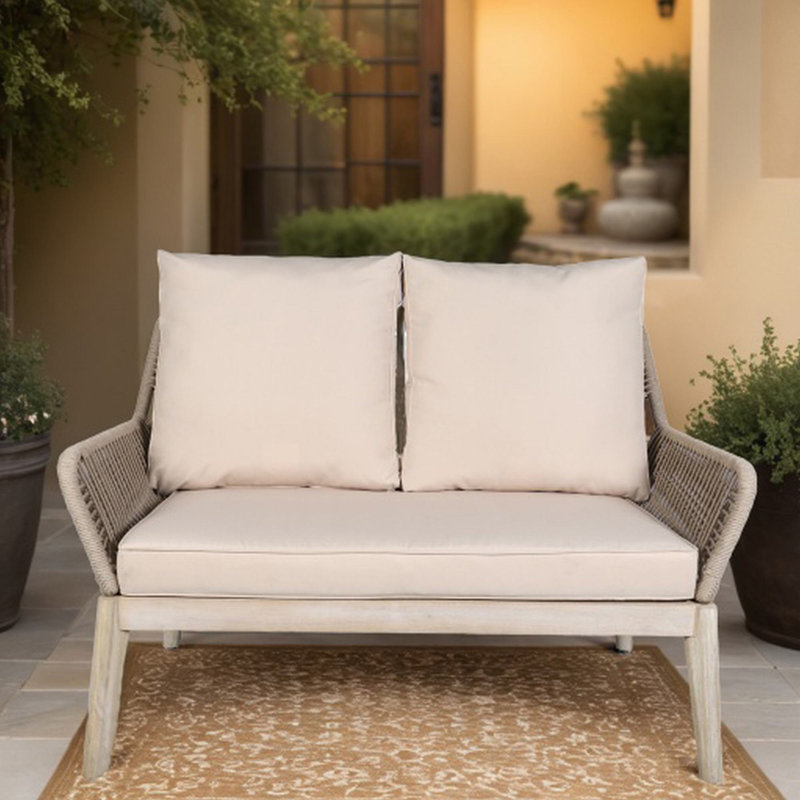 Banc de patio en bois d'acacia avec coussins Beryna
