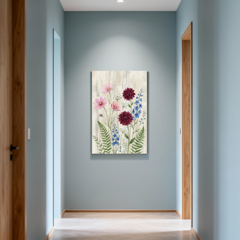 Arrangement floral de plantes et de fleurs avec des fleurs roses et mauves, H 18 po x l 12 po
