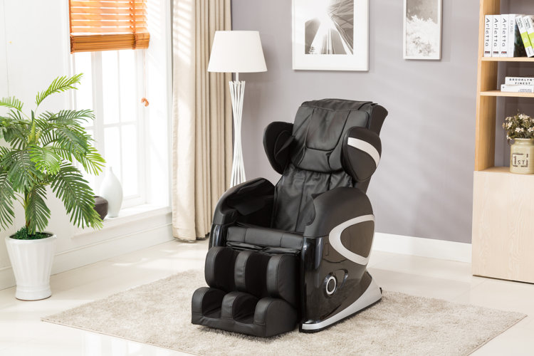 black leather massage chair in a modern living area with a beige rug and floor plant