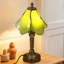 Lampe de table en verre teinté vert avec base en résine bronze