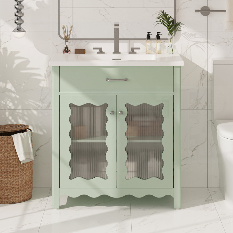 Meuble-lavabo moderne avec verre trempé et portes à fermeture douce, pieds en bois d'hévéa pour plus de durabilité et de style.