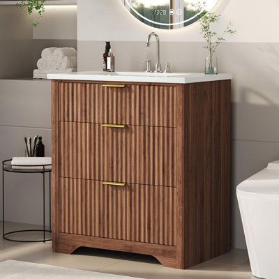 Meuble-lavabo moderne avec lavabo en céramique blanche, panneau en bois à texture ondulée, tiroirs rabattables et profonds