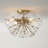 15.5" W x 11" H 4-Light Starburst Semi Flush in Matte Brass with Patterned Glass Petals