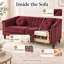 Fauteuil capitonné rouge, avec accoudoirs arrondis et garniture cloutée.-1510258905