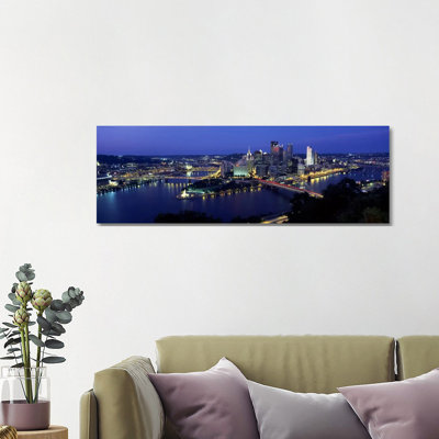 Buildings Along A River Lit Up At Dusk, Monongahela River, Pittsburgh, Allegheny County, Pennsylvania, USA - Wrapped Canvas Panoramic Print