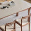 Une table de salle à manger en pierre avec une structure en bois de hêtre-1137927863-1137927856
