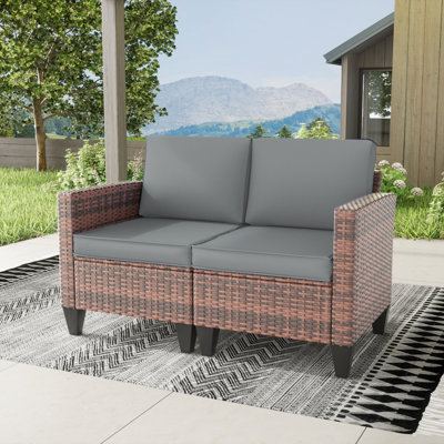 Kisner 49" W Outdoor Wicker Loveseat With Cushions by Ebern Designs