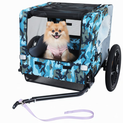 Remorque robuste pour animaux pliable conçue pour une utilisation à l'extérieur avec des vélos, équipée de roues tout-terrain de 16 pouces et d'un attelage universel, fonctionne comme un transporteur pliable pour les chiens ou le fret, agencée en bleu et gris.