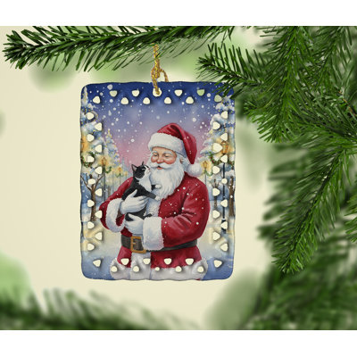 Ornement chat noir et blanc avec père Noël en porcelaine