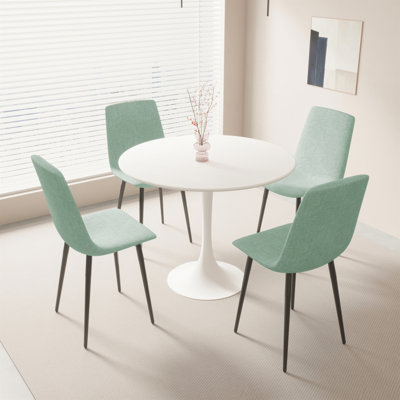Ensemble de table de salle à manger 31,5 po en MDF rond pour 4 personnes, table de salle à manger blanche en MDF facile à nettoyer avec des pieds en métal noir durable, une chaise de salle à manger confortable en lin 4 pièces pour le restaurant, les réceptions des invités