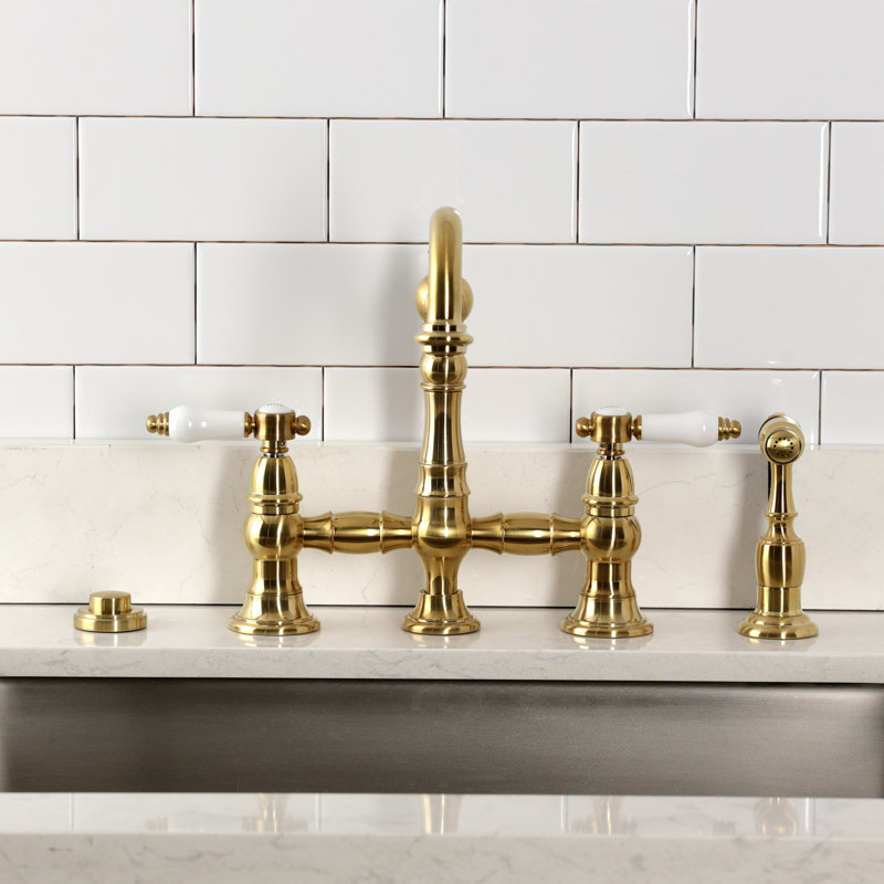 Kingston Brass Bel-Air Two-Handle 4-Hole Deck Mount Bridge Kitchen Faucet With Brass Side Sprayer, Brushed Brass